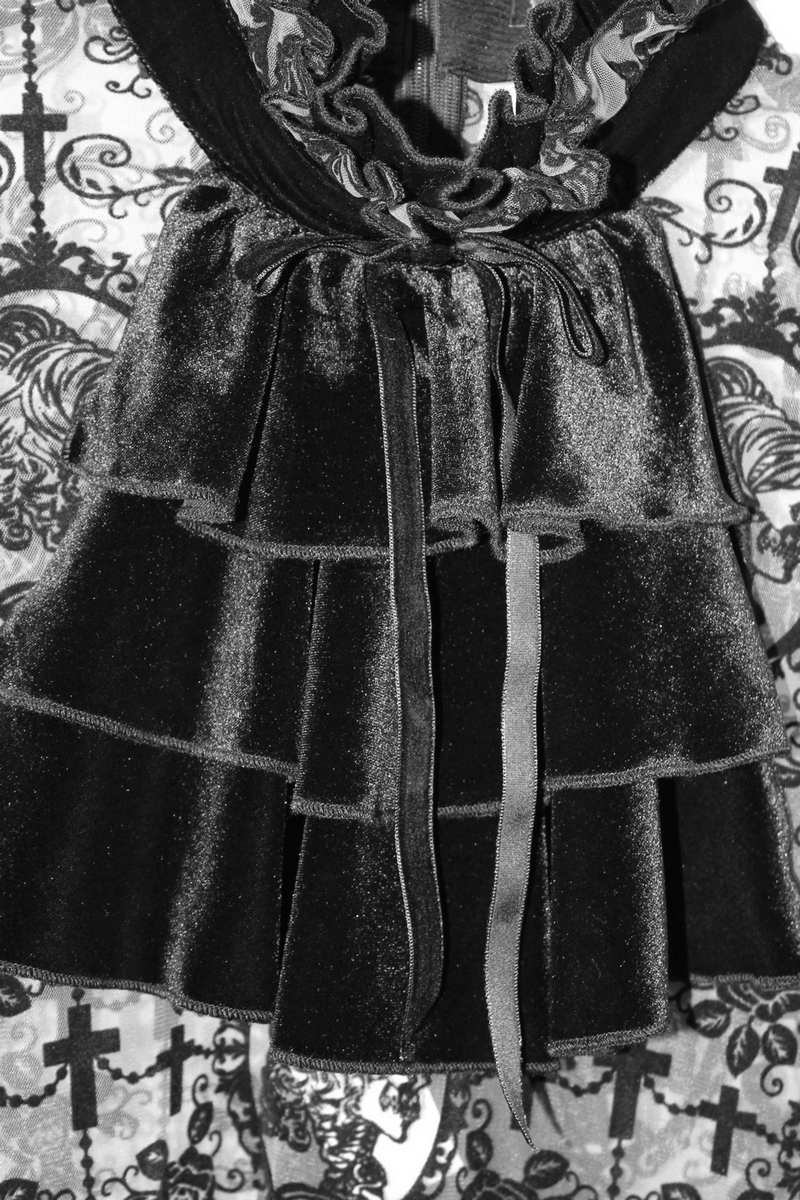 Close-up of a black lace gothic dress with ruffled layers and elegant detailing for women.