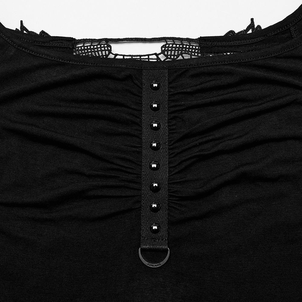 Close-up of the pleated chest and lace detail on the back of a sexy black off-shoulder dress for women.