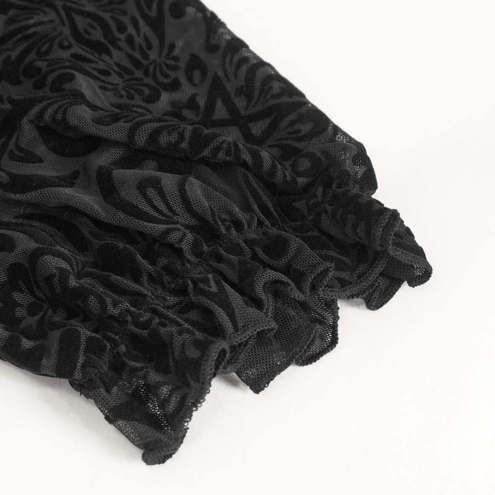 Close-up of the black lace blouse sleeves featuring intricate patterns and elegant fringing details.