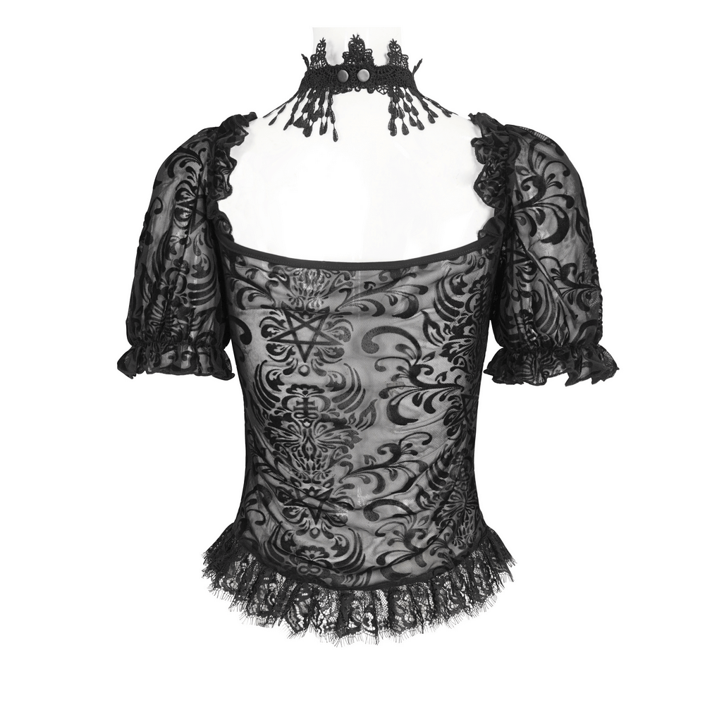 Sexy black lace blouse with puff sleeves, intricate patterns, and fringe detailing, perfect for chic day-to-night elegance.