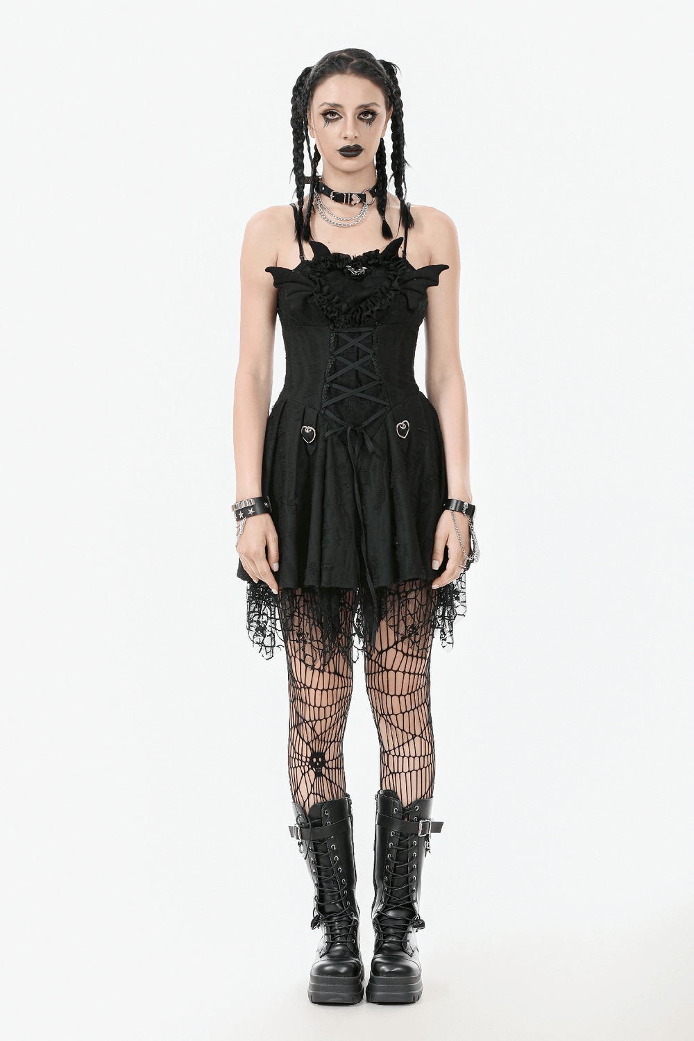 Sexy lace corset dress with heart clips and mesh hem, paired with fishnet stockings and combat boots.
