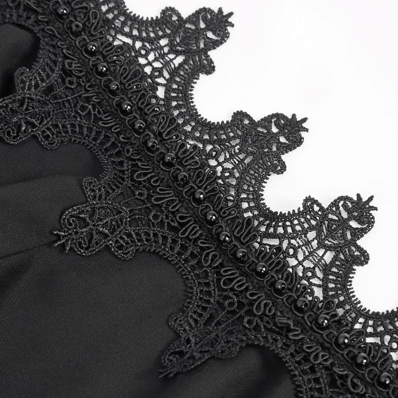 Close-up of elegant black lace trim with intricate patterns on a transparent blouse, showcasing Gothic style.