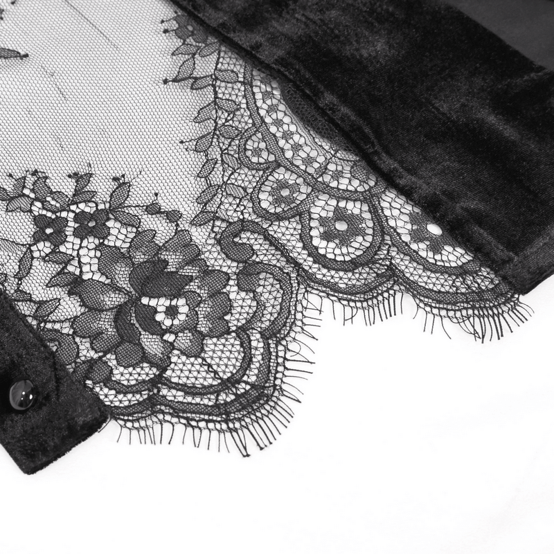 Close-up of intricate black lace detailing on a gothic-style blouse, showcasing elegance and texture.