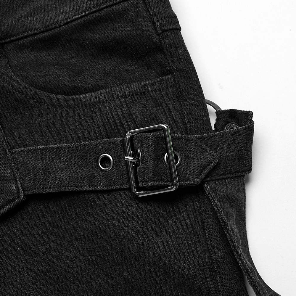 Close-up of black denim shorts with lace-up detail and silver buckle for an edgy fashion touch.