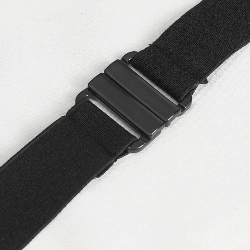 Close-up of a black elastic belt with a sleek metal buckle, ideal for pairing with fashion-forward outfits.