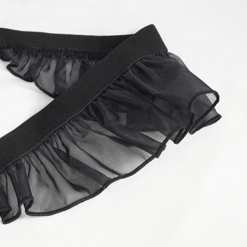 Close-up of black lace frill detail on a gothic lingerie dress, showcasing elegant sheer texture.