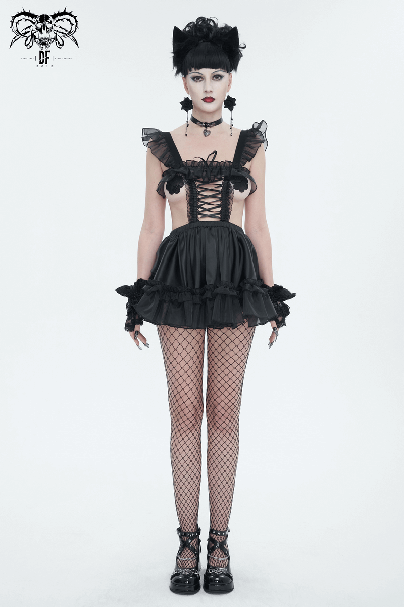 Model wearing a black gothic hollow-out lingerie dress with frills and lace, showcasing edgy fashion.