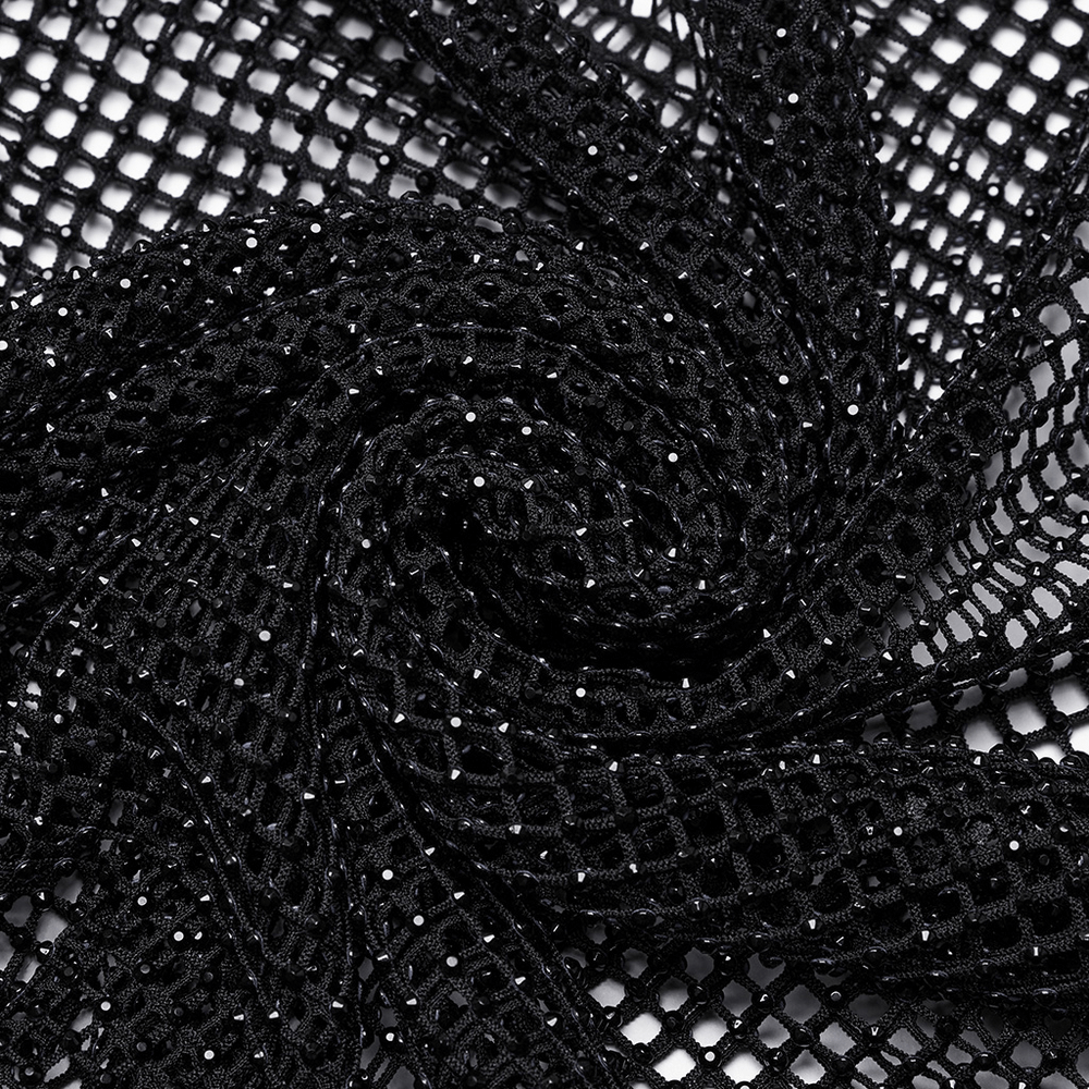 Close-up of black mesh fabric with sparkling rhinestones, perfect for a daring bodysuit design.
