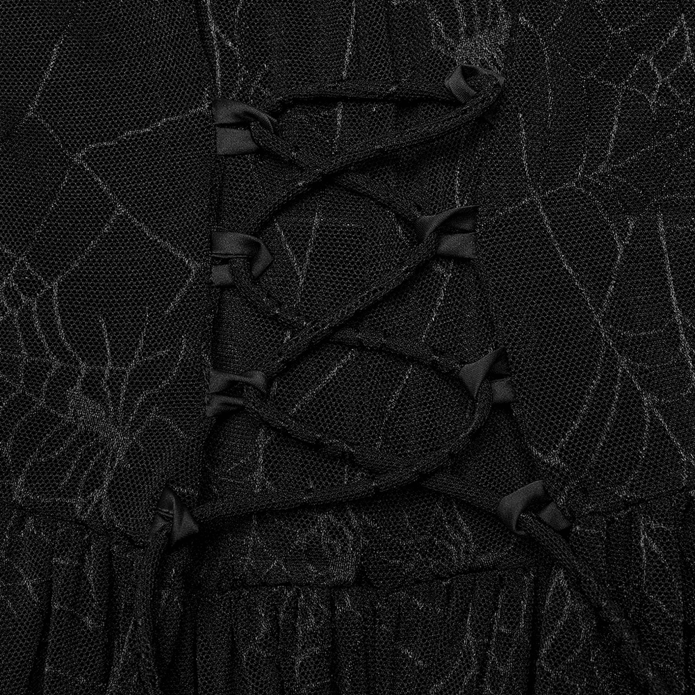Close-up of the spiderweb mesh and lace-up detail on a sexy gothic dress.