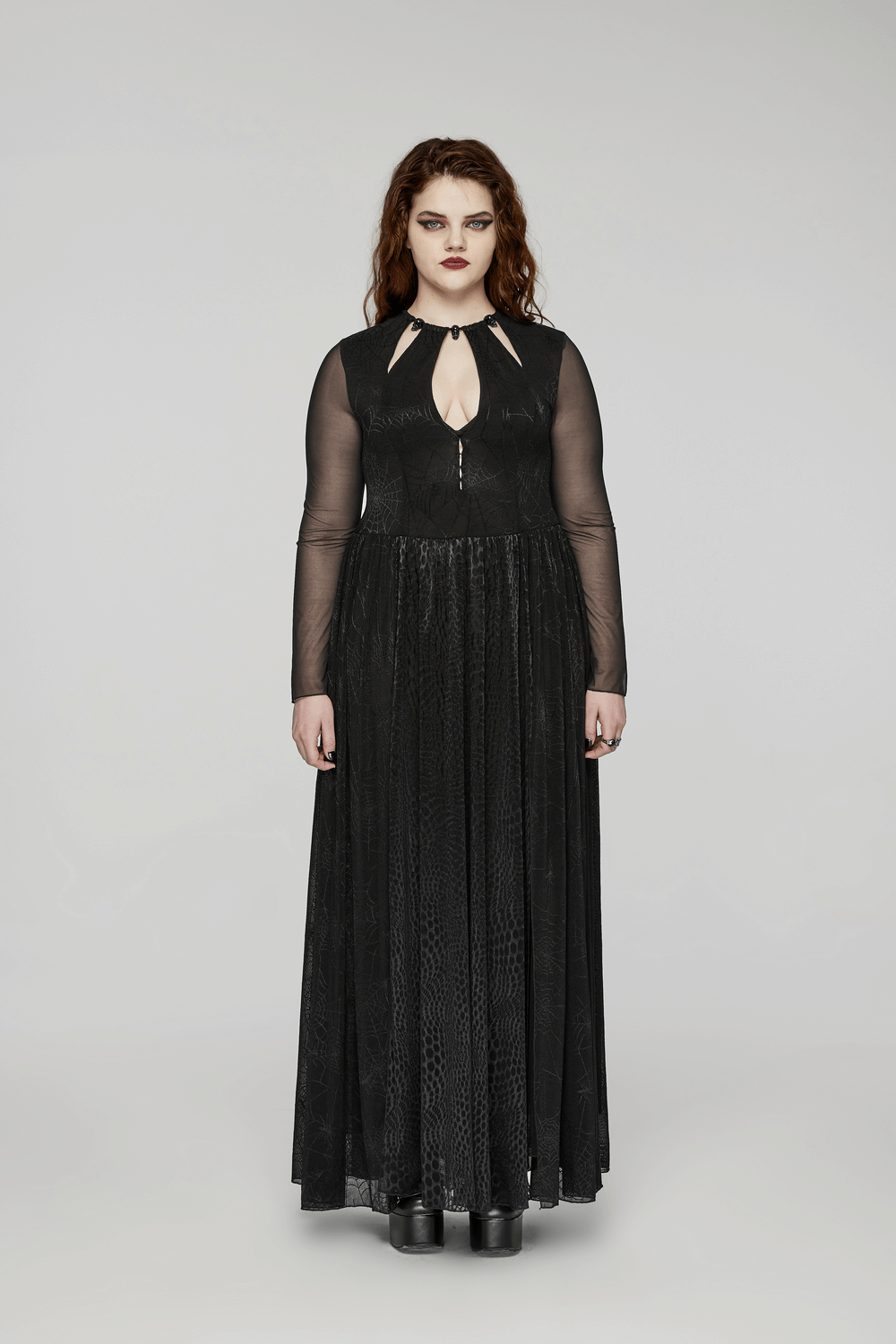 Gothic long-sleeved mesh dress with spiderweb design and python pattern, featuring a keyhole neckline.