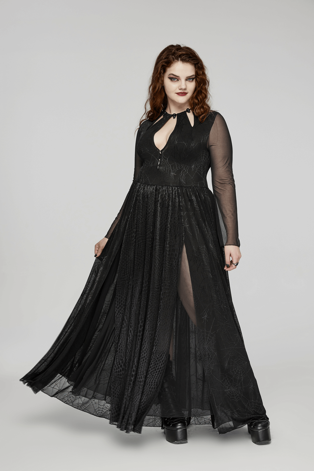 Gothic dress with spiderweb design, long sleeves, and stylish slit. Perfect for dark elegance enthusiasts.
