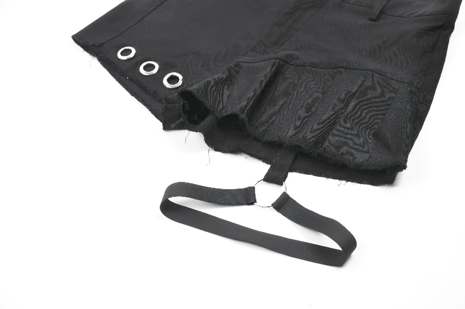Edgy black pleated shorts with eyelet details and detachable O-ring strap, perfect for punk-inspired outfits.