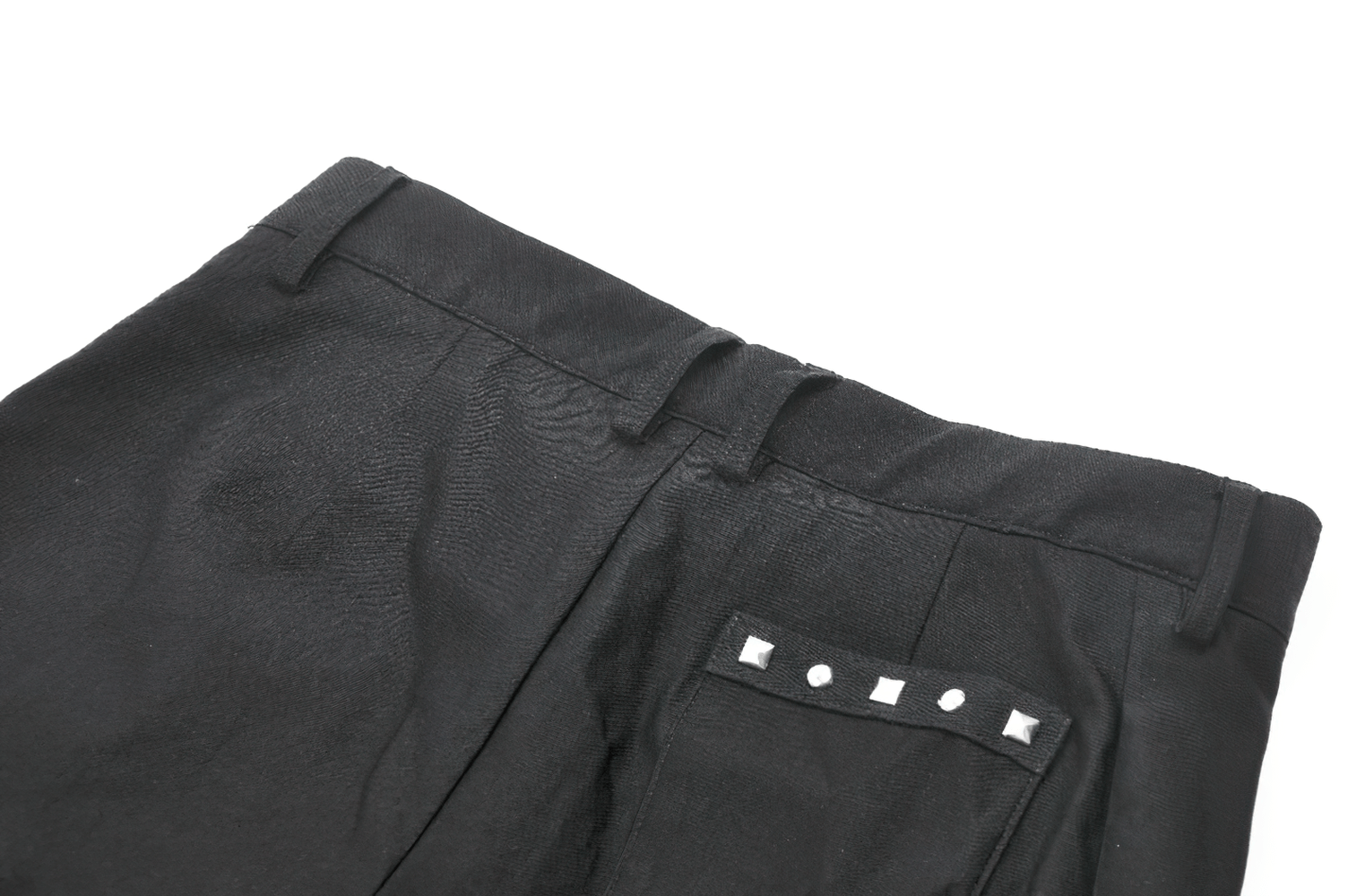 Gothic pleated shorts featuring a studded back pocket design and raw hem finish for punk-inspired streetwear.