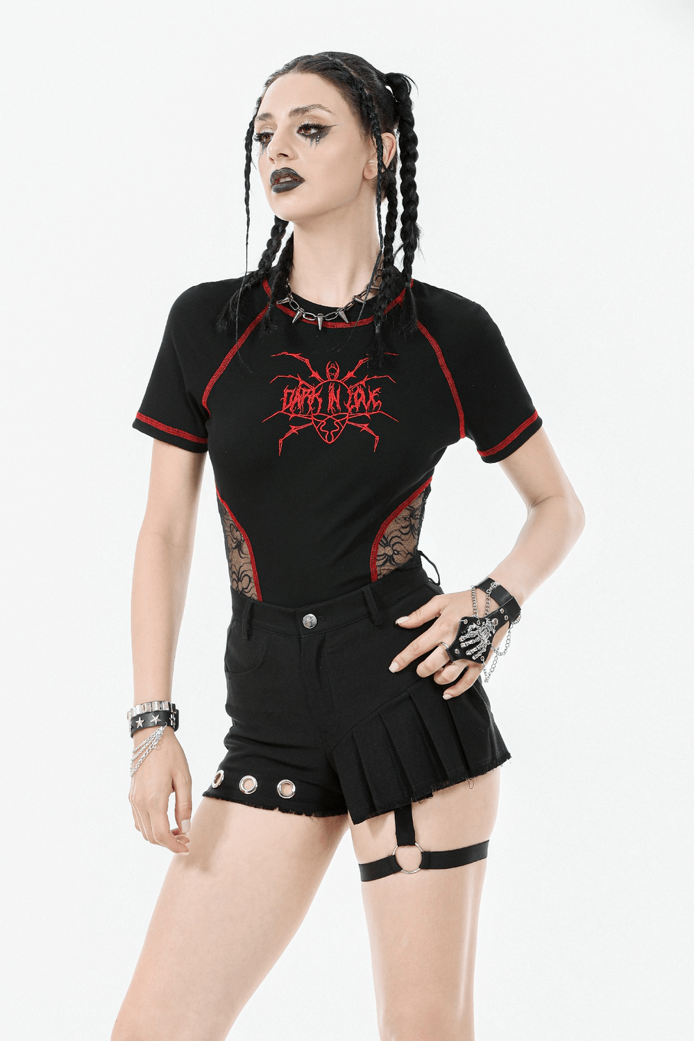 Model in punk-inspired sexy pleated shorts with O-ring strap and eyelet detail, showcasing edgy streetwear style.