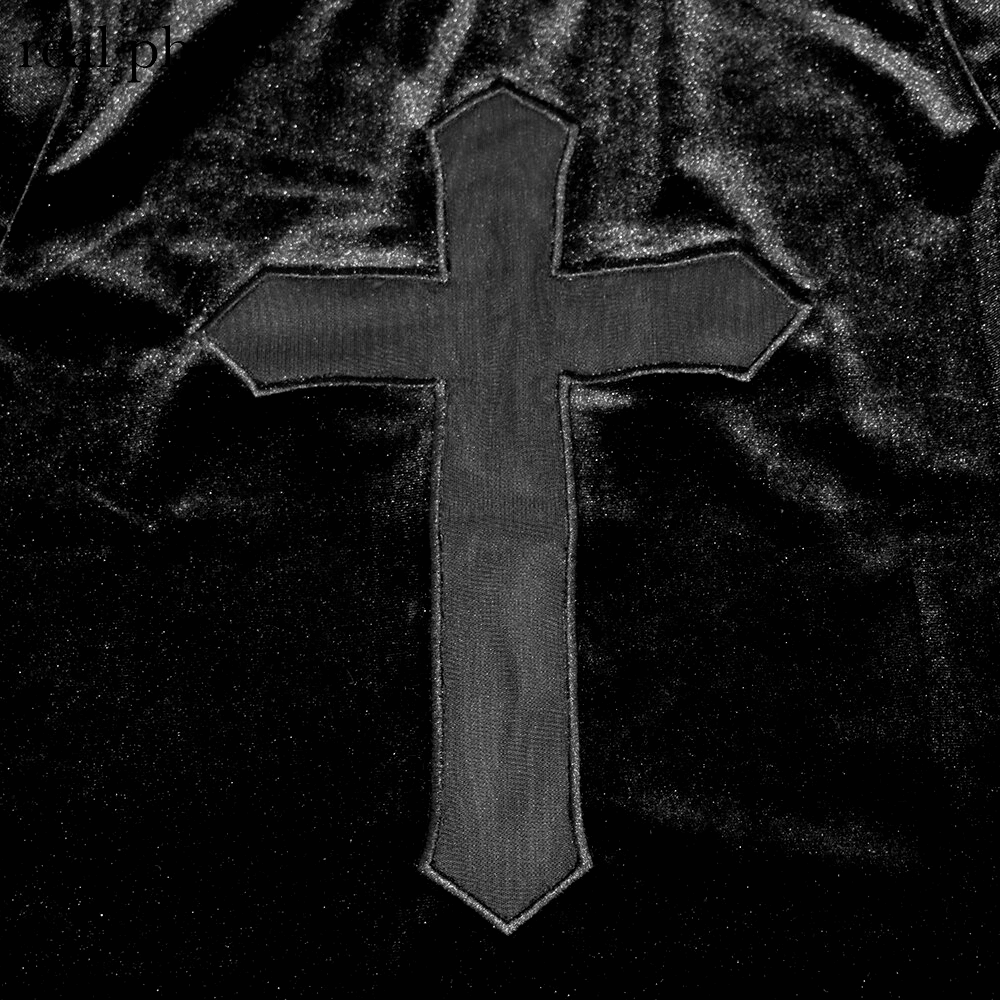 Close-up of a sheer black cross motif on a punk style shirt, showcasing edgy fashion and alternative design.