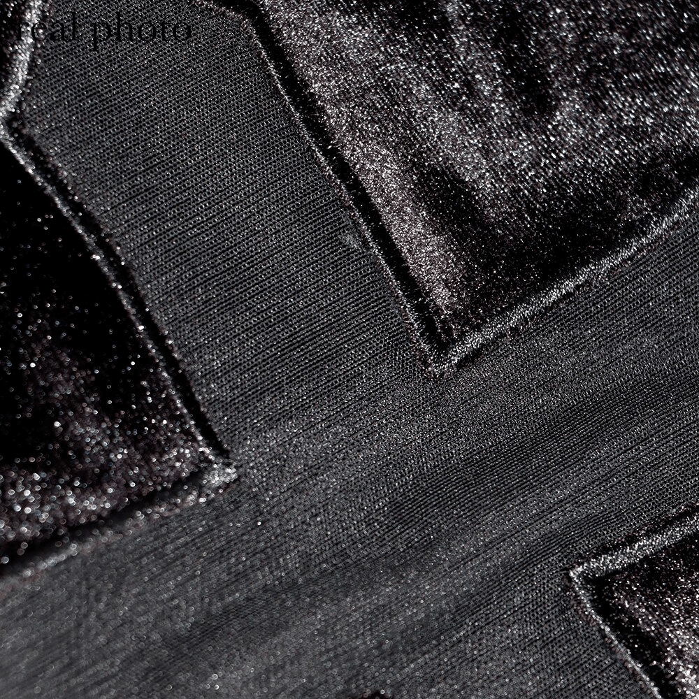 Close-up of a sheer cross design on a sexy punk black T-shirt, showcasing its unique texture and edgy style.