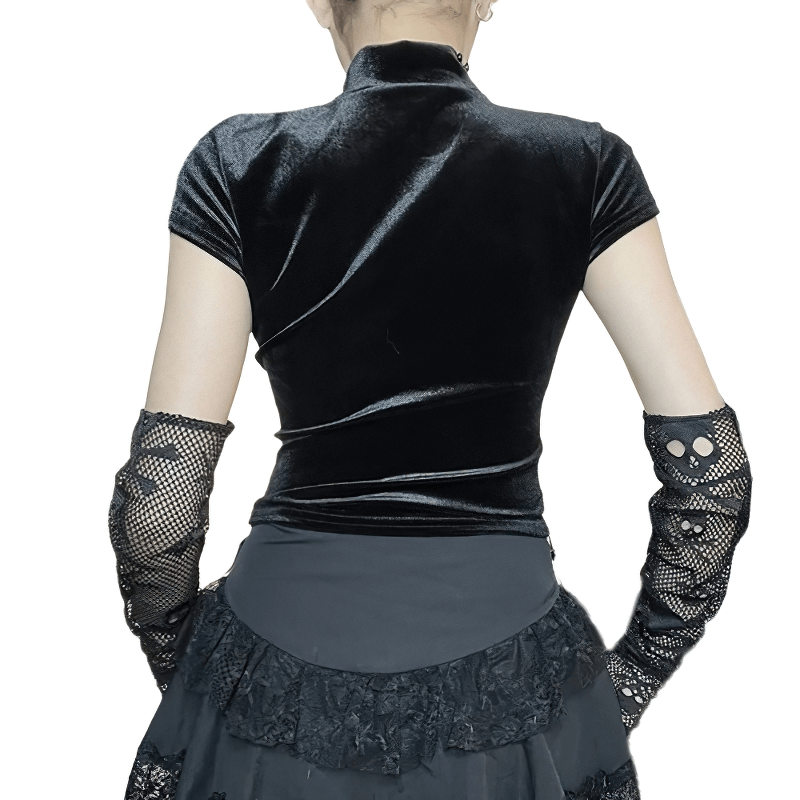 Back view of sexy punk black T-shirt with sheer cross, paired with a stylish ruffled skirt and fishnet gloves.