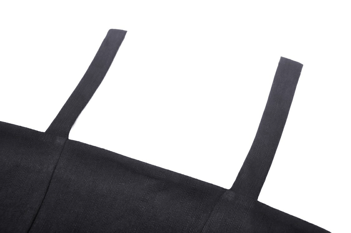 Close-up of straps on a sexy punk black crop top with a daring cutout design.