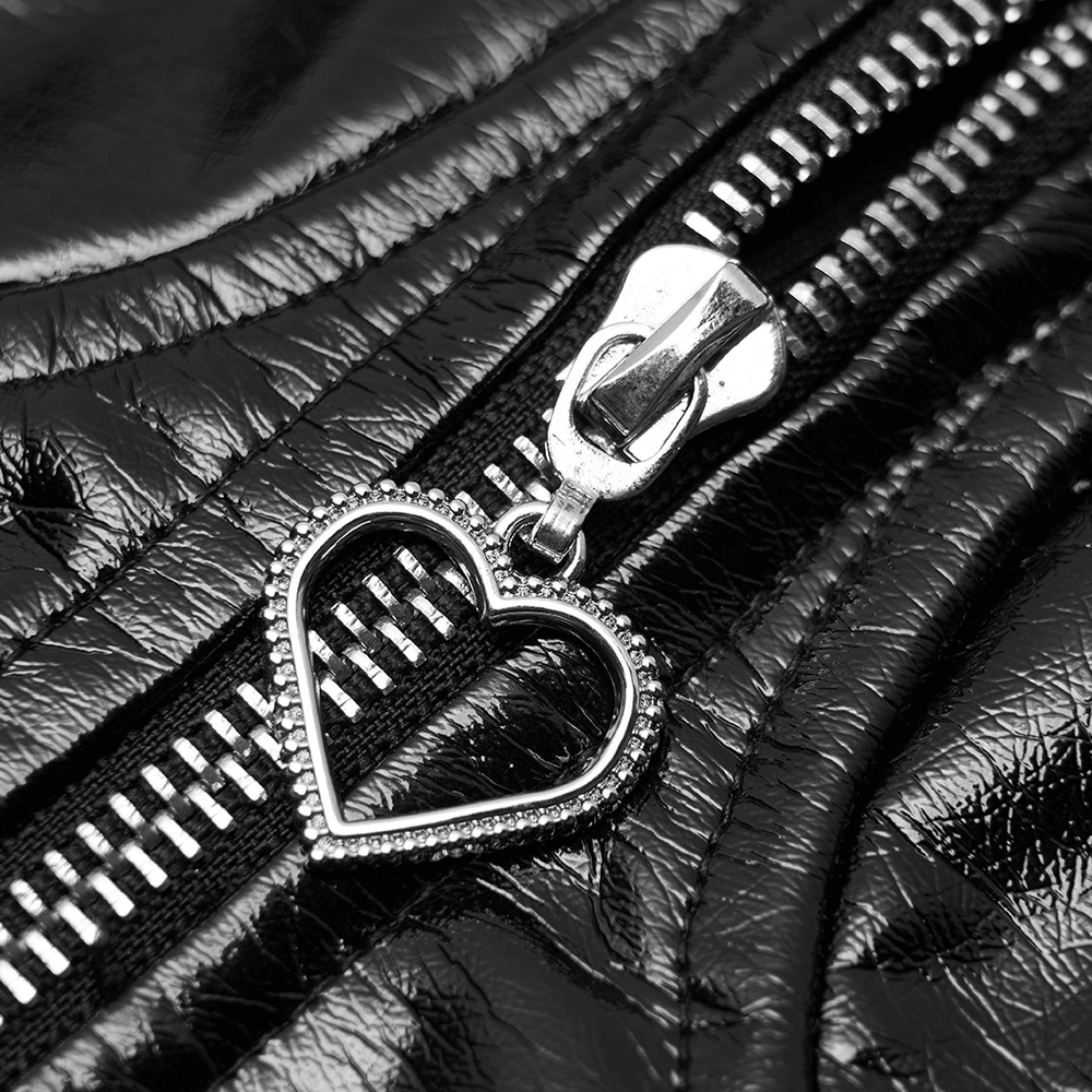 Close-up of a stylish black zipper with a heart-shaped pull on PU leather fabric.