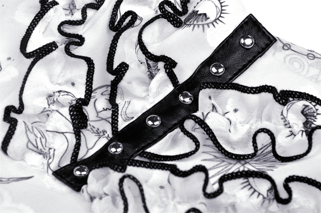 Close-up of punk strap dress featuring intricate lace trim and stylish black button details.