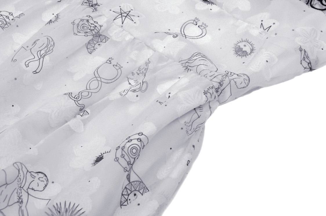 Close-up of the sexy punk strap dress with lace trim, featuring playful animal and astrological prints on white fabric.