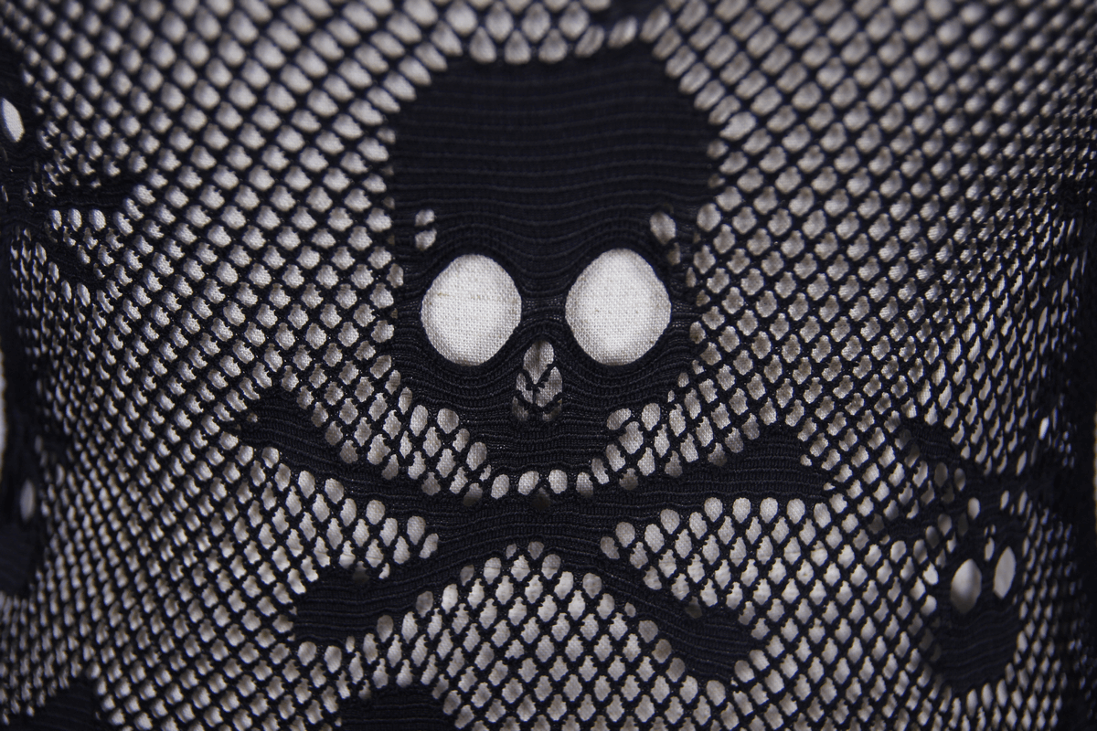 Close-up of black mesh fabric featuring skull and crossbones design, perfect for gothic fashion lovers.