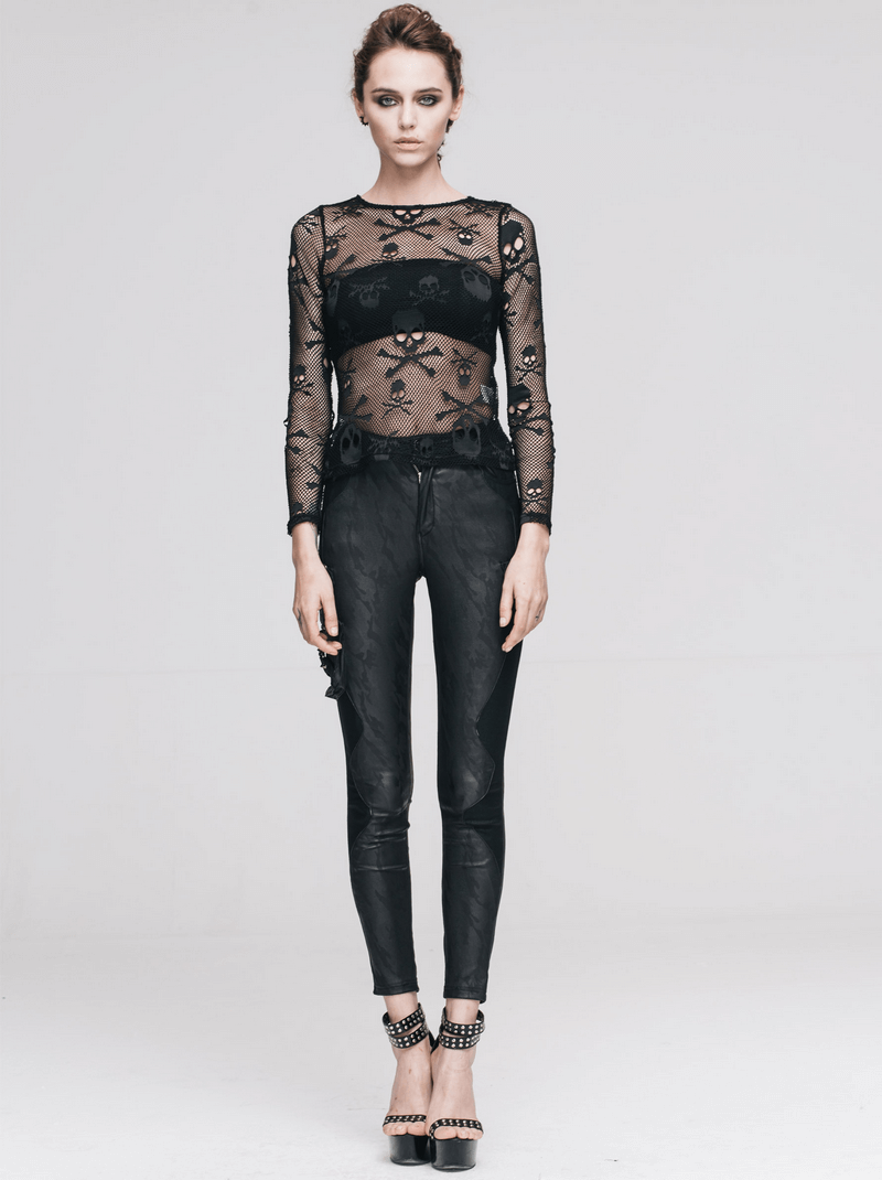 Model wearing a black mesh skull long sleeve top paired with chic black pants, showcasing gothic fashion style.