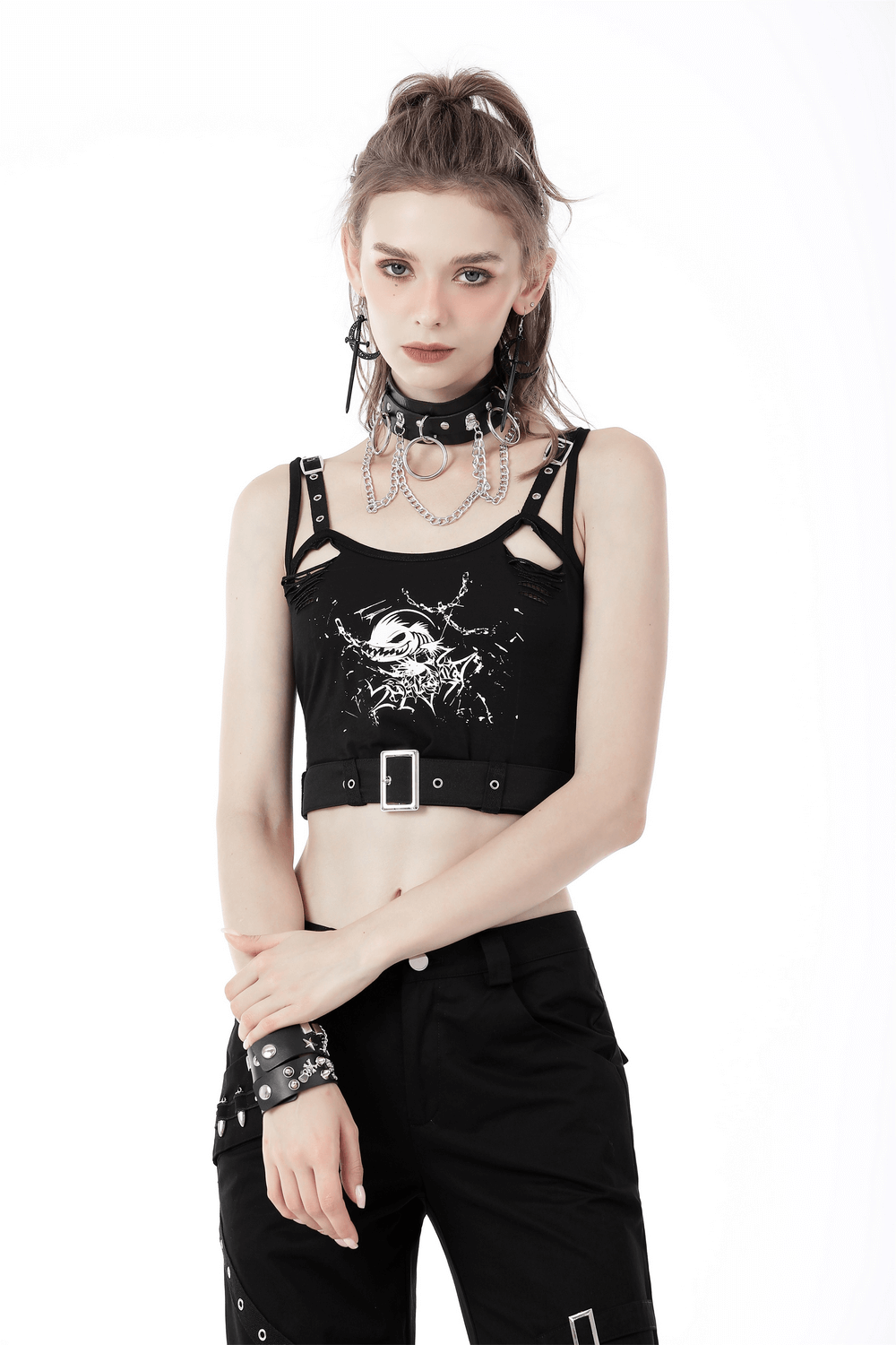 Stylish woman wearing a black skull print crop top with buckle, showcasing a gothic edge and flattering fit.