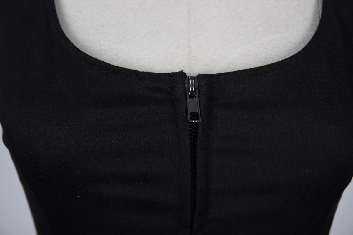 Close-up of a black women's sleeveless tank top featuring a stylish zipper in the middle for a chic look.