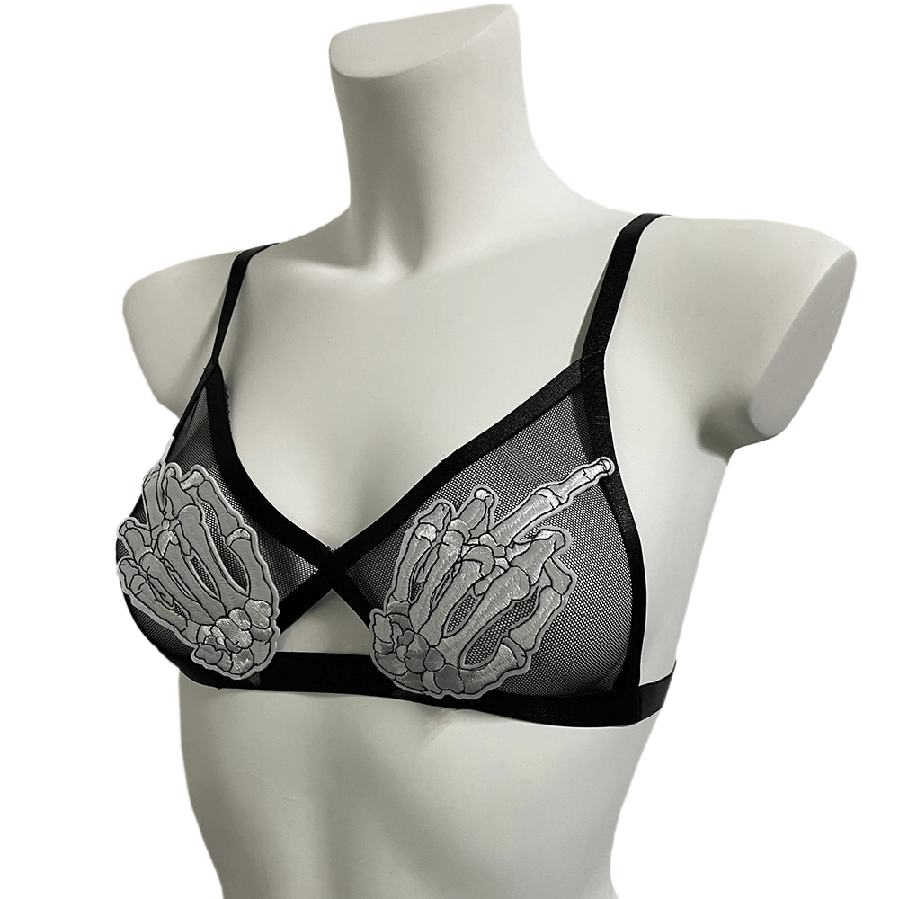 Gothic transparent bra with skeleton patches, featuring adjustable straps for a daring, provocative look.
