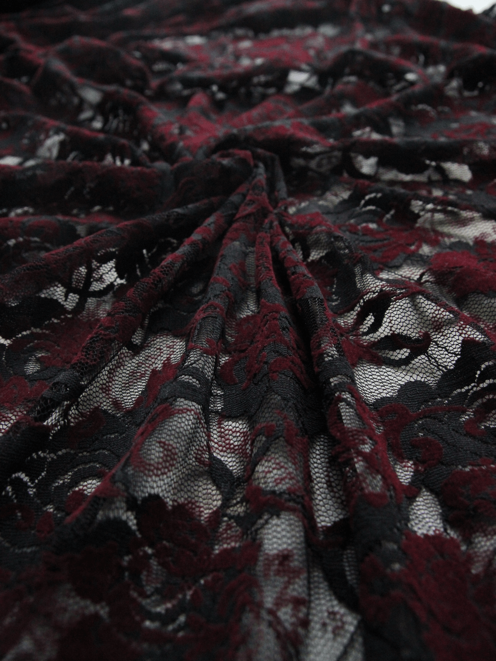 Elegant maroon and black lace fabric displaying intricate floral patterns, ideal for gothic night dresses.