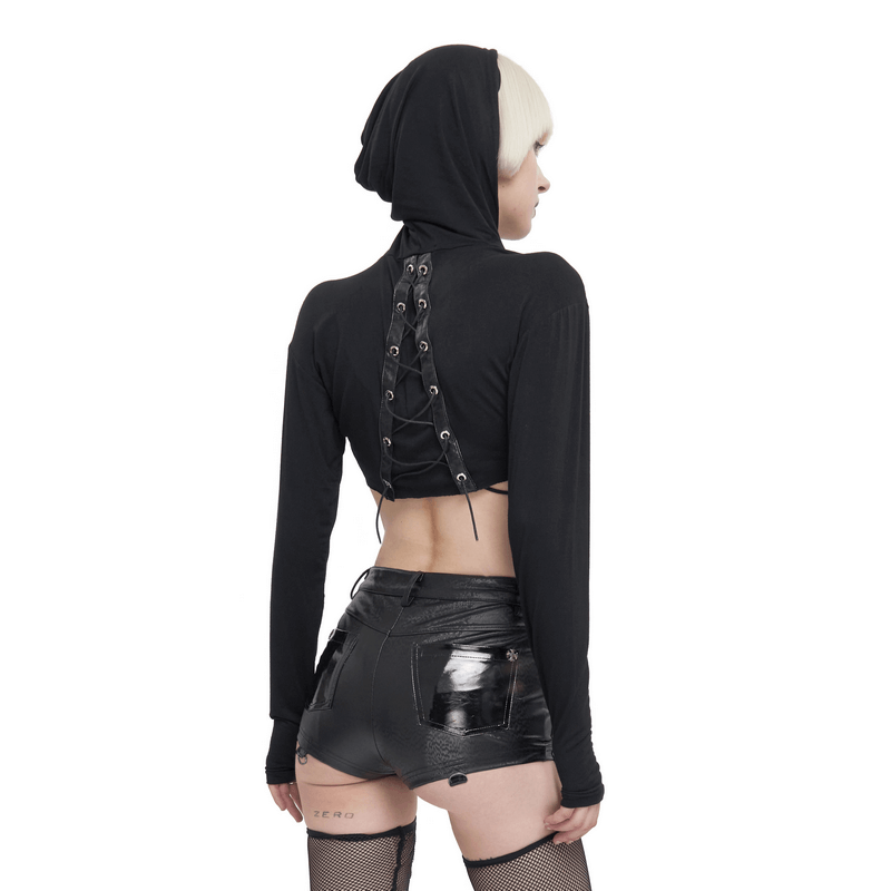 Back view of a woman wearing a sexy transparent gothic top with a lace-up design, paired with shiny black shorts.