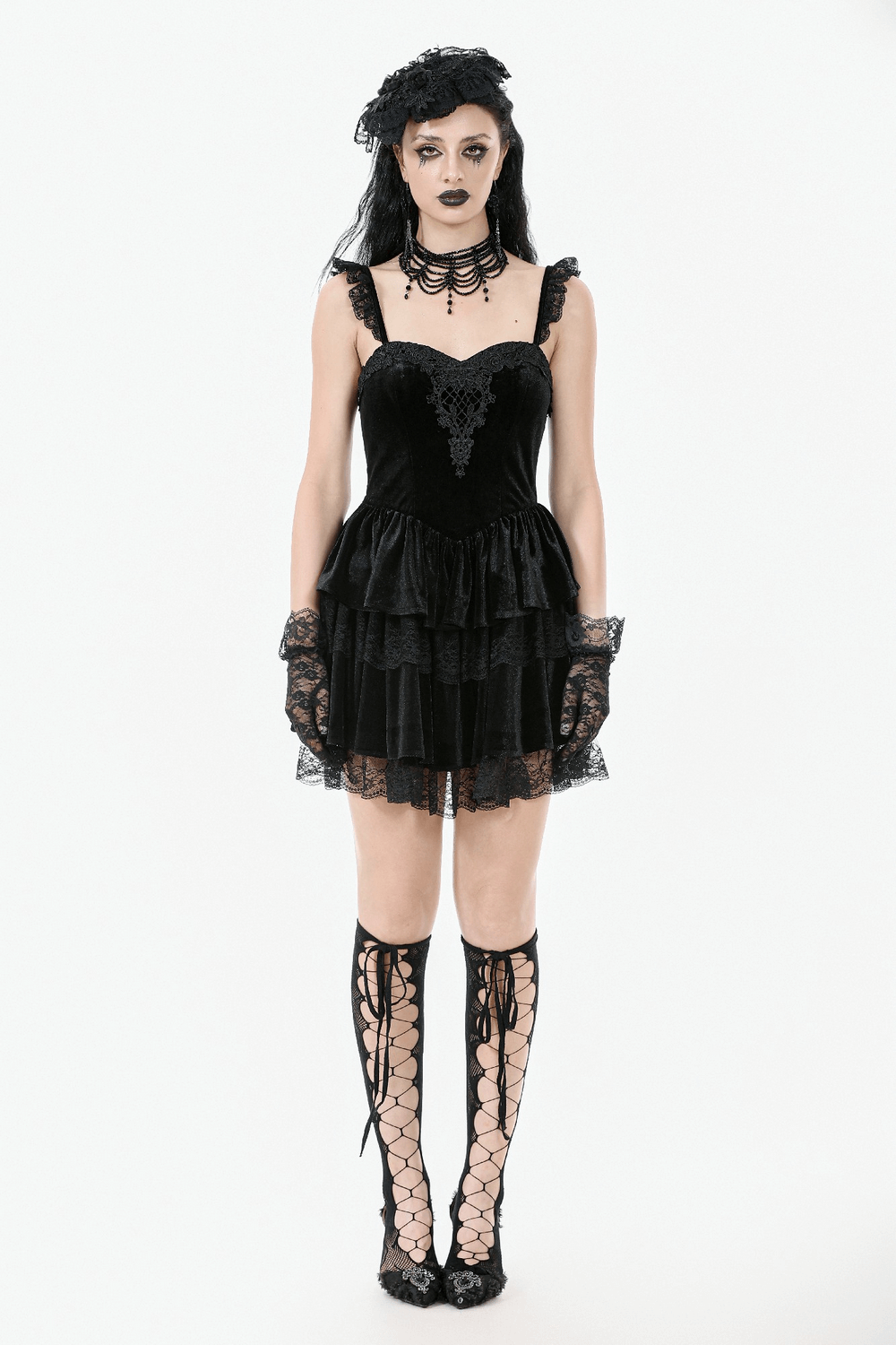 Gothic black velvet mini dress with lace ruffles, corset detail, and dramatic Victorian style accessories.
