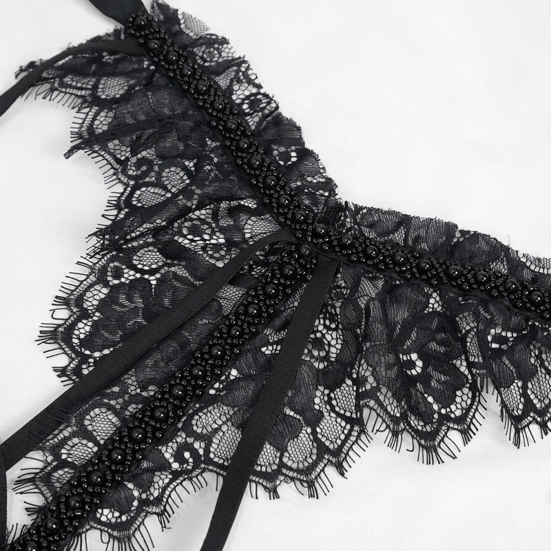 Close-up of elegant black lace detailing with beads, perfect for accessorizing gothic fashion styles.