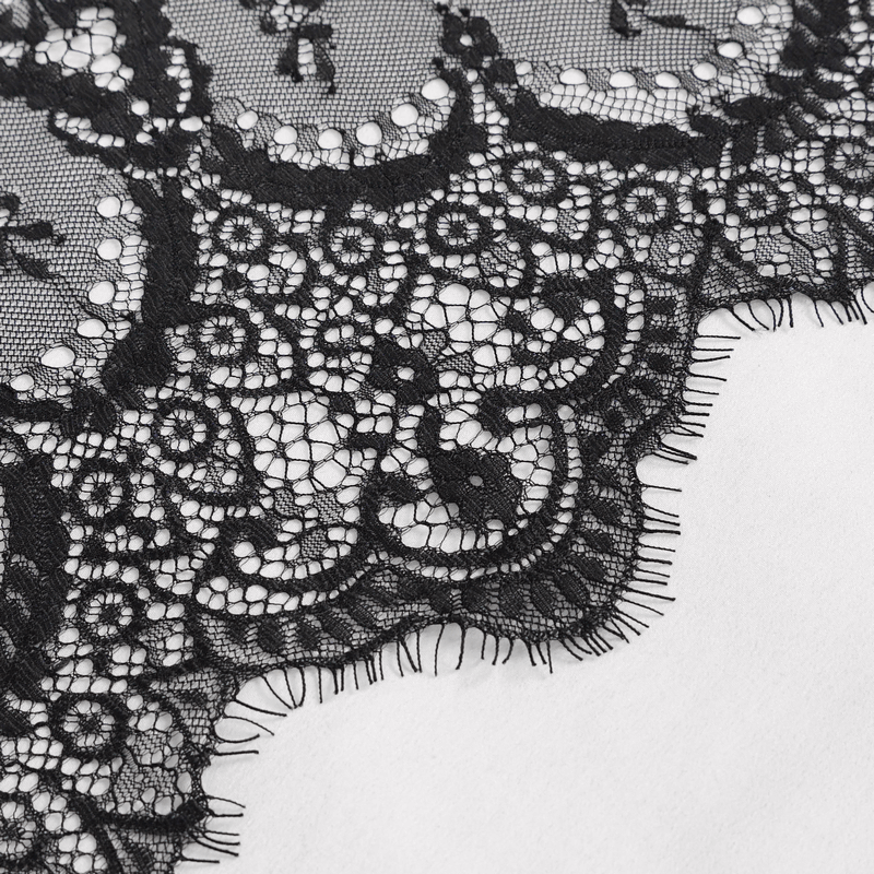 Close-up of intricate black lace detail showcasing elegant gothic design for a sexy velvet dress.