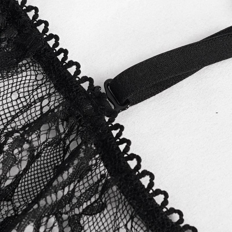 Close-up of intricate black lace fabric with delicate trim and adjustable strap details for a seductive touch.