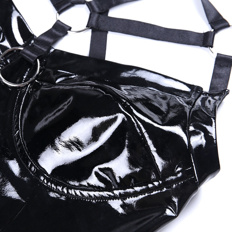 Close-up of a black PU leather hollow out gothic top with shiny finish and stylish ring details.