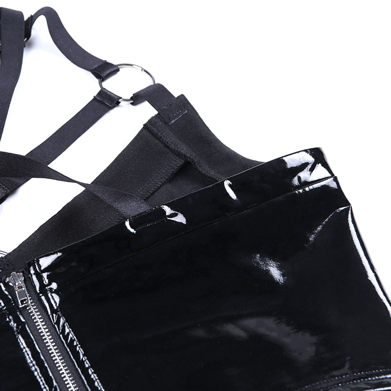 Close-up of a black gothic hollow out top featuring shiny PU leather and strappy details, perfect for Halloween or cosplay.