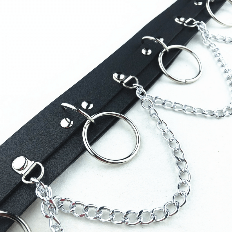 Edgy women's belt with rings and chains, alternative fashion accessory for bold style statements.