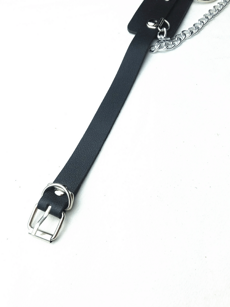 Edgy women's belt with rings and chains, perfect alternative fashion accessory for bold style statements.
