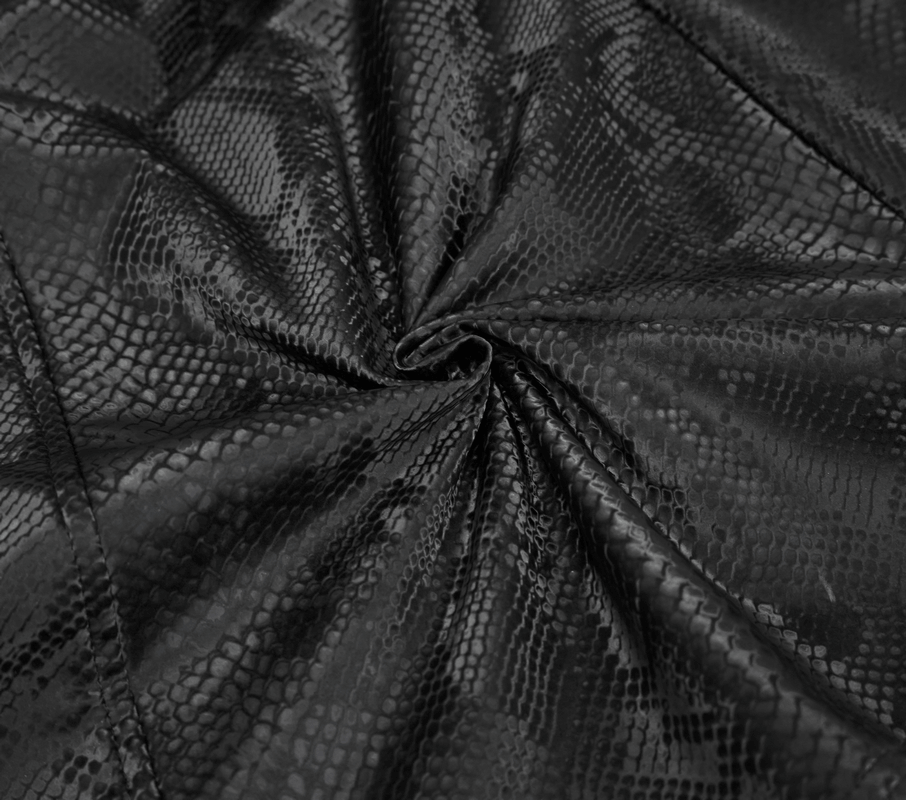Textured black synthetic leather with a stylish snake print pattern, perfect for gothic fashion pieces.