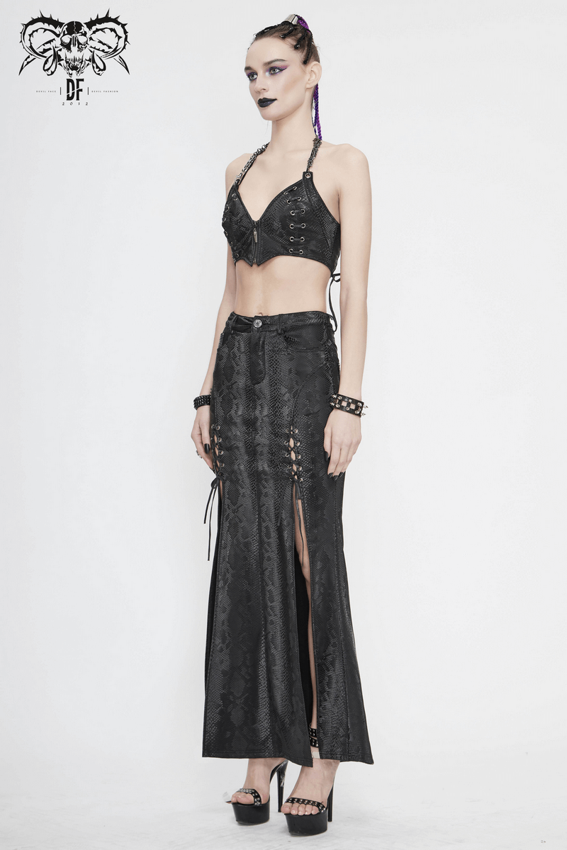 Gothic women's black long skirt with high slit and lace-up details, paired with a stylish black crop top.