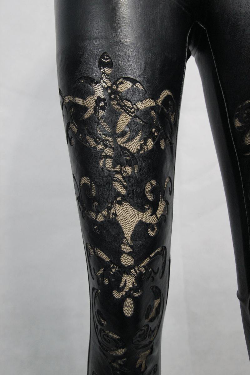 Close-up of sexy women's black faux leather pants with hollow-out lace details, perfect for gothic fashion lovers.