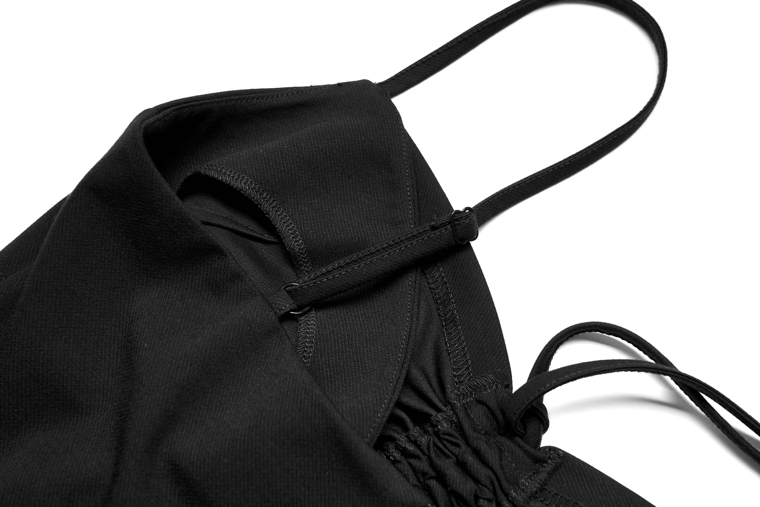 Close-up of the adjustable drawstring detail on a black halter neck mini dress for a custom fit.