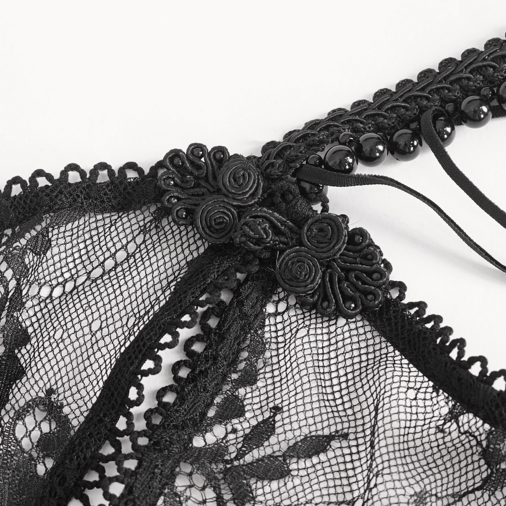 Close-up of sexy black lace lingerie details with intricate floral embellishments and elegant stitching.