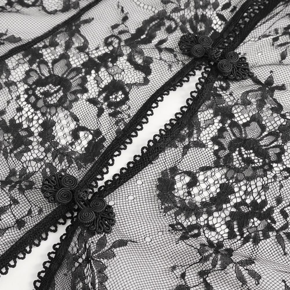 Elegant black lace detailing with floral patterns on backless lingerie, showcasing intricate design and embellishments.