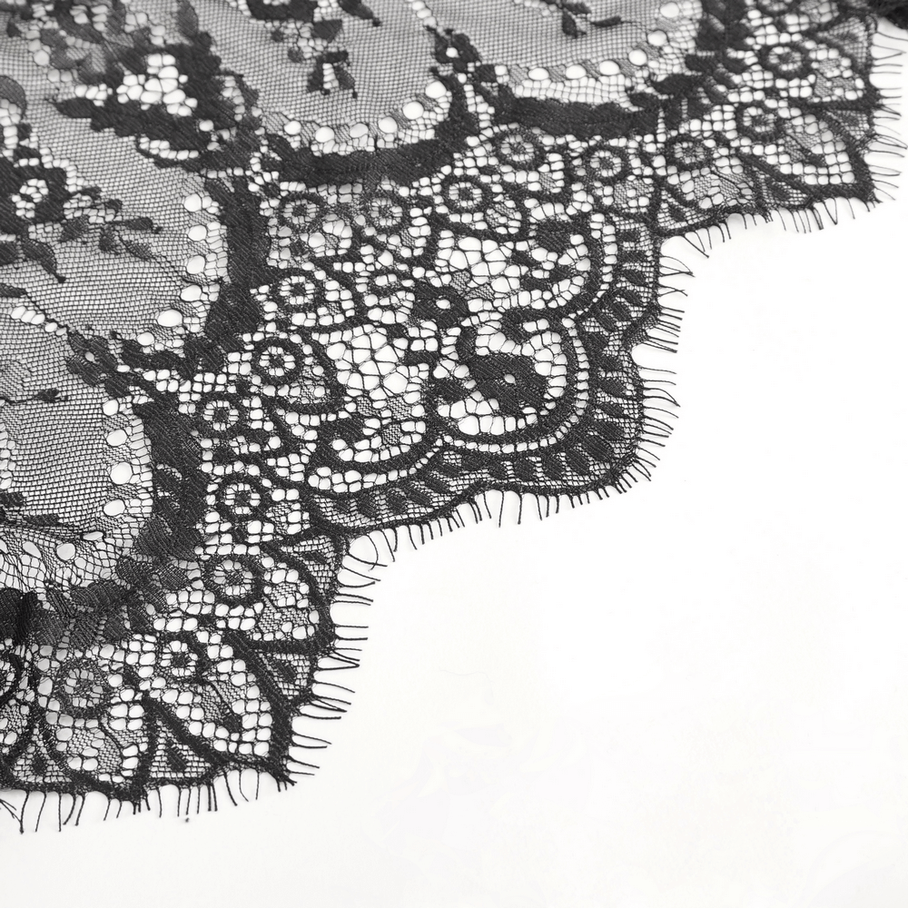 Elegant black lace fabric showcasing intricate designs and delicate fringes for lingerie.