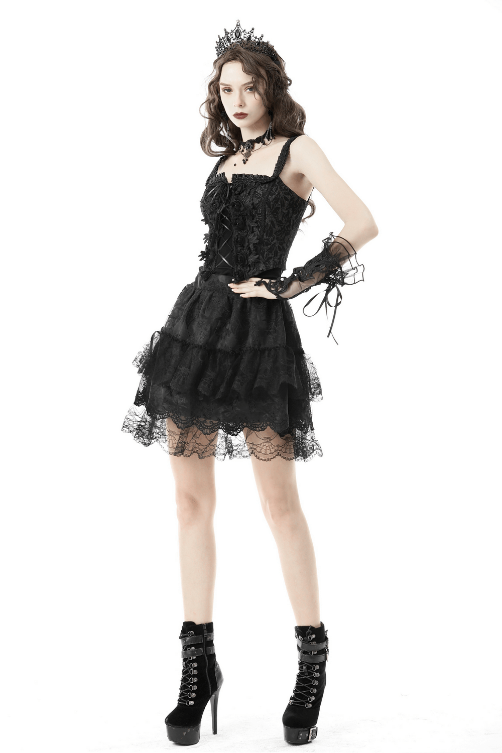 Elegant black lace-up corset dress with ruffled layers and gothic accessories, perfect for a darkly stylish look.