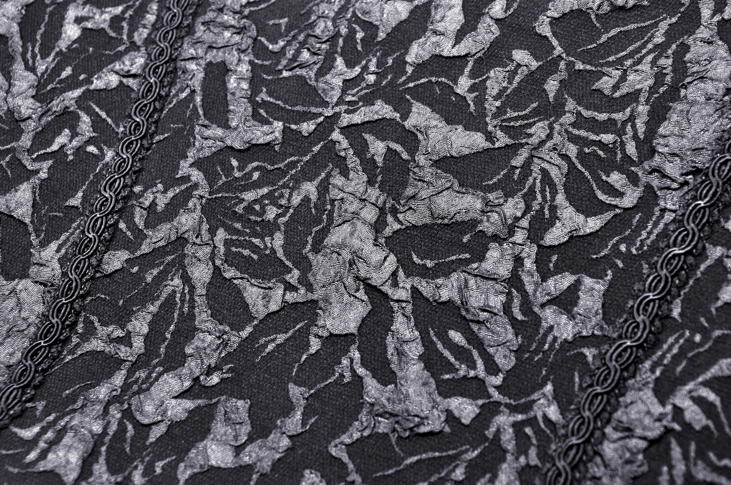 Elegant black lace fabric with intricate design, perfect for a sexy corset or gothic-inspired fashion.