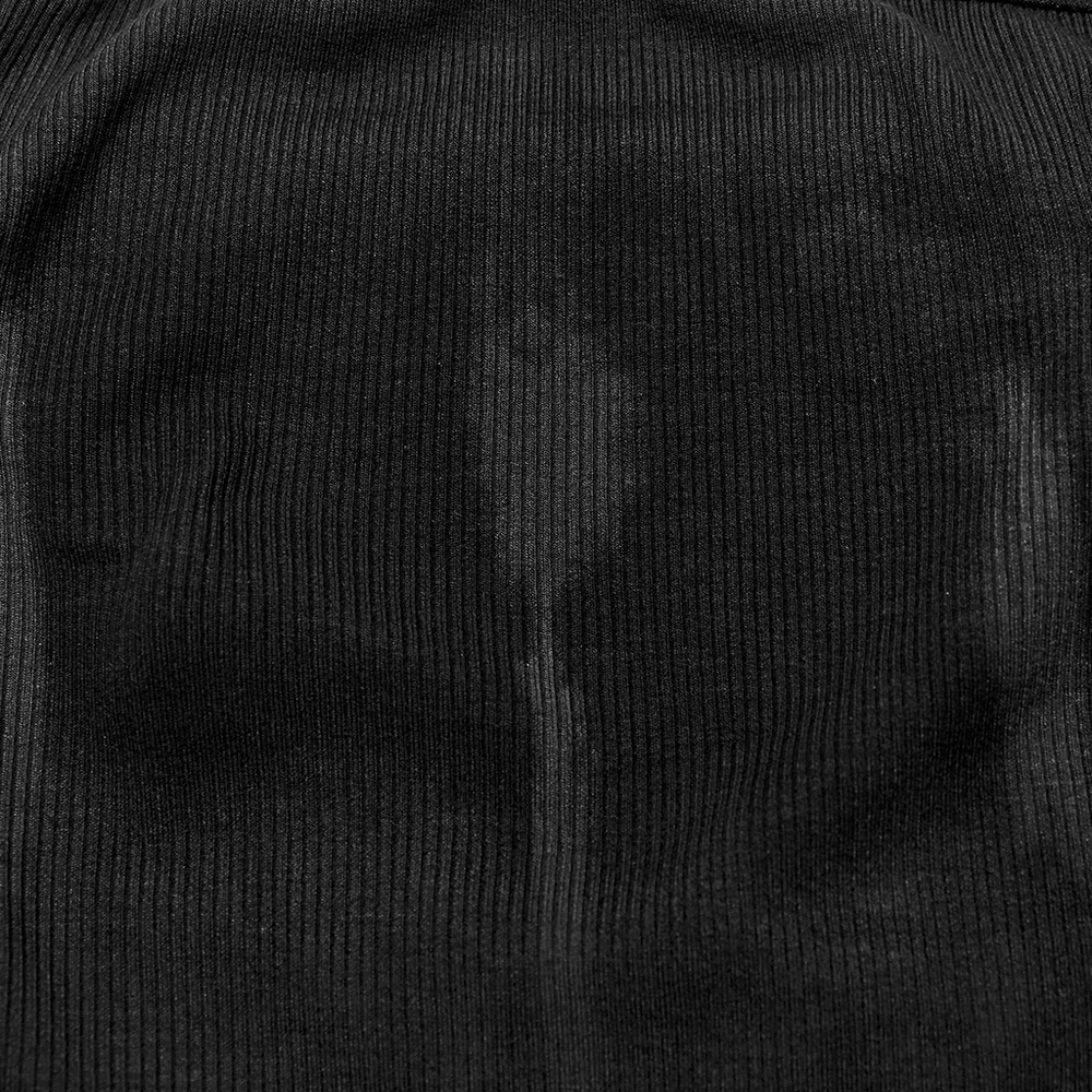 Close-up of stretchy rib knit fabric, showcasing a black strapless tube top with a subtle sheen and texture.